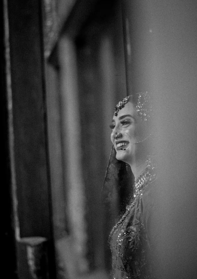 A candid black and white bridal portrait